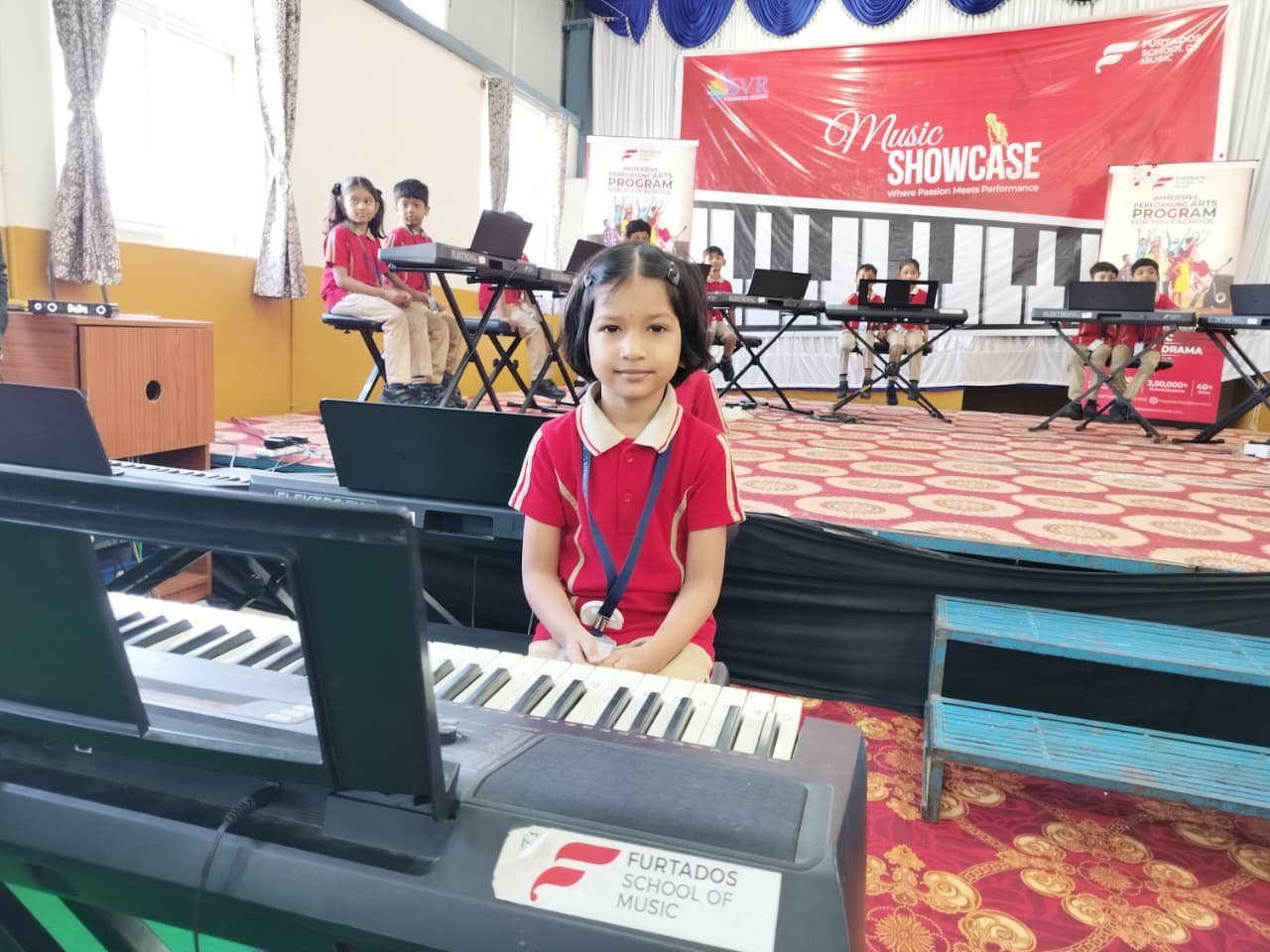 Parents and teachers playing keyboard during Musical Culmination - image 2